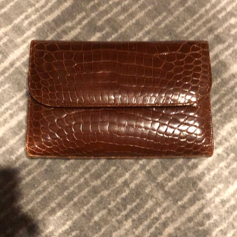 Brown leather clutch.